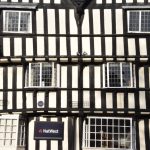 A half-timbered wall with windows.